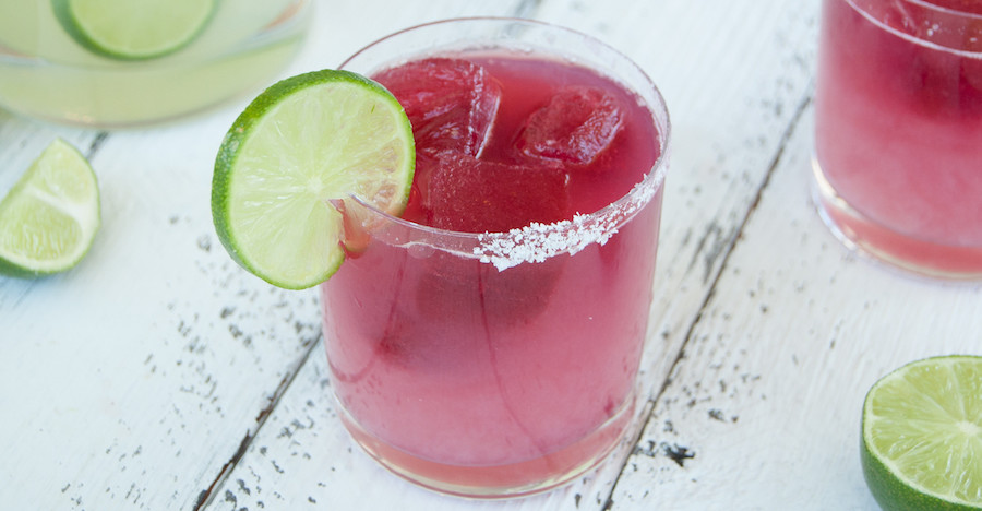A margarita with salt and lime on the rim.